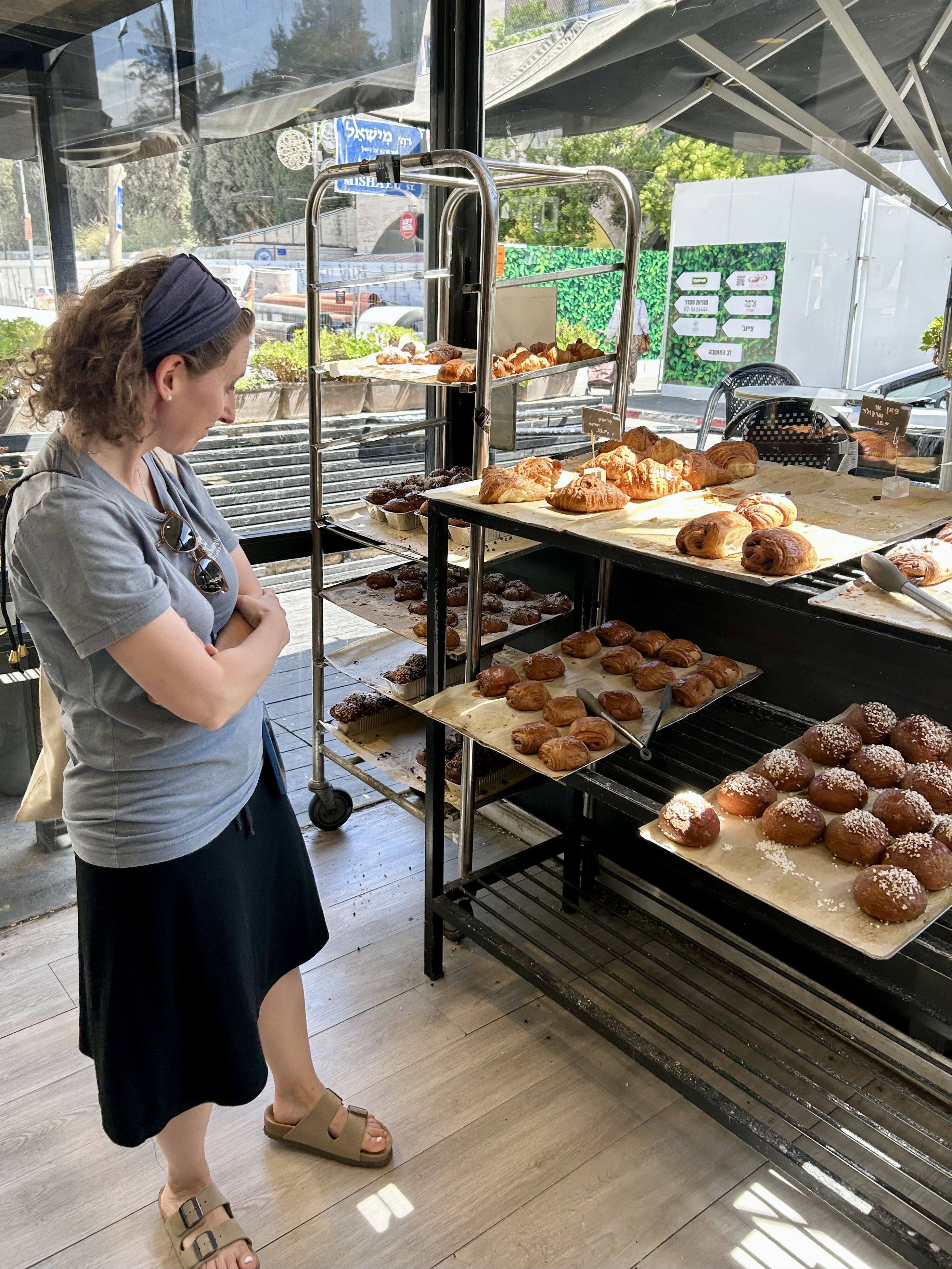 Sarah’s carefully selecting croissants at French bakery Moulin Dore on Emek Refaim.