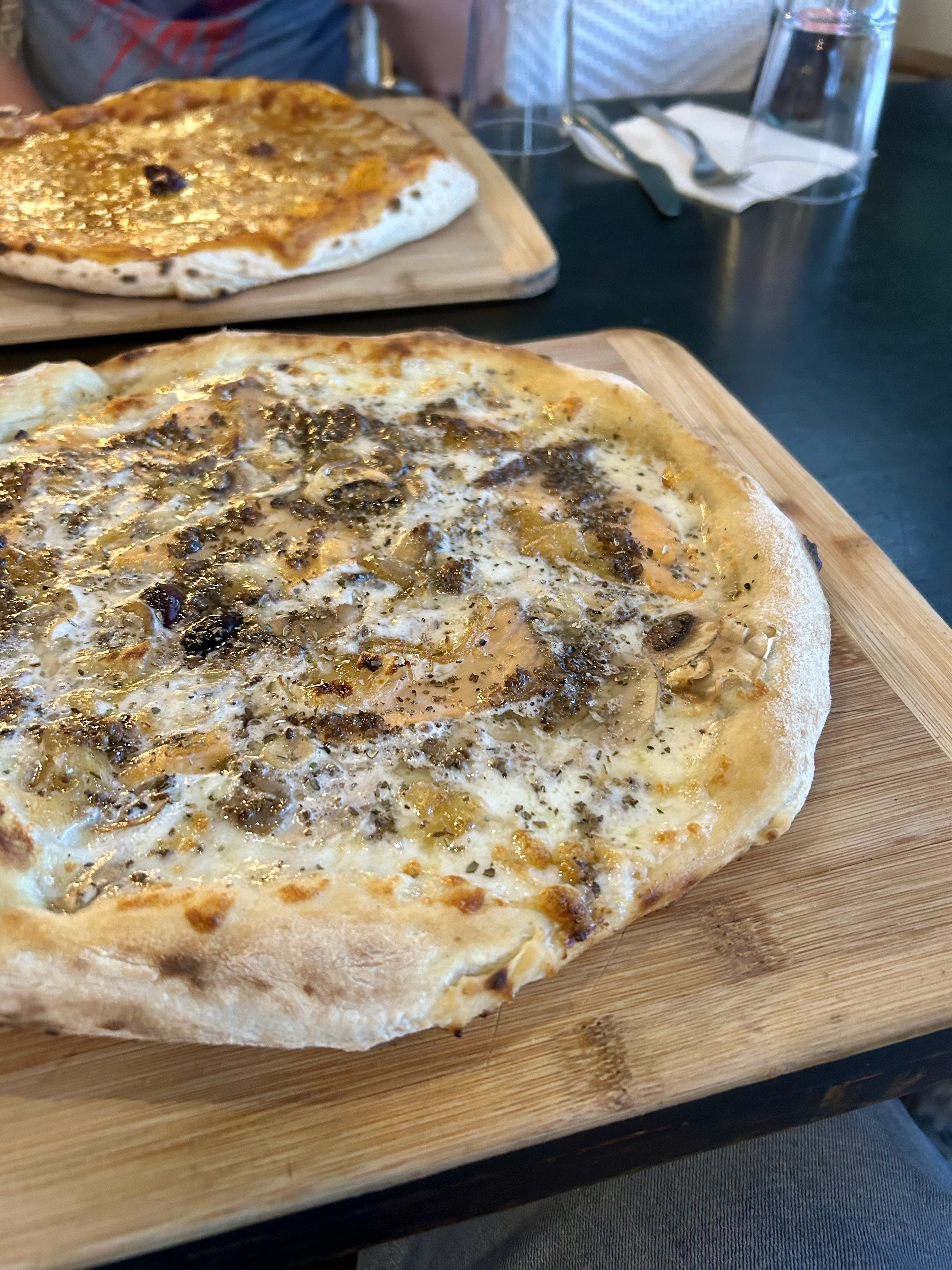 Moshe and Jonathan try pizzas at Rendez-Vous in Baka