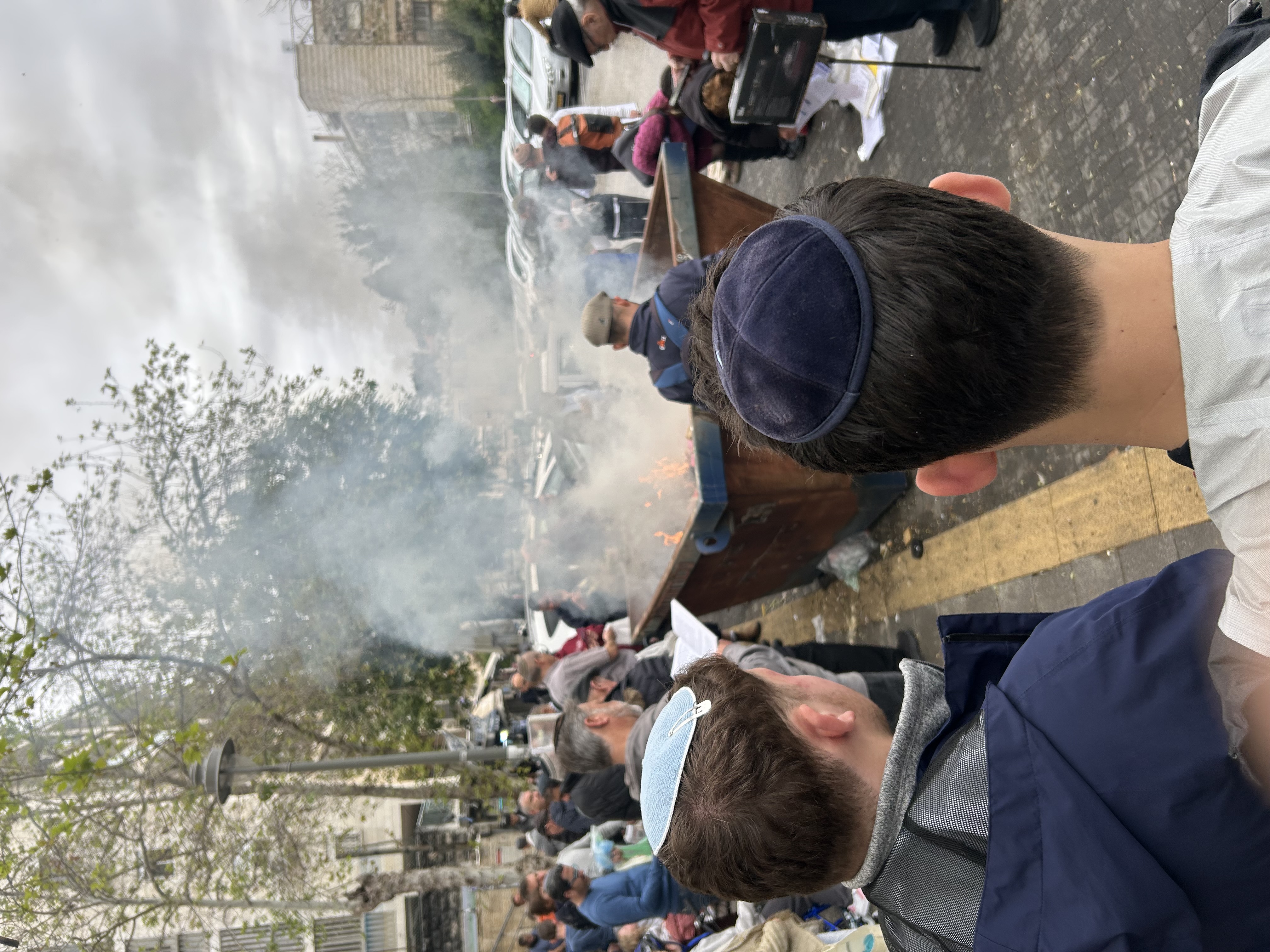 Avi and Moshe at the neighborhood spot for “burning of the leaven” just before Passover